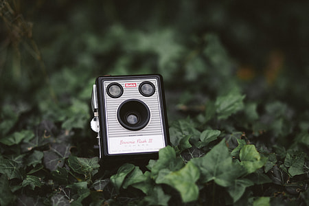 photo of black and gray camera on ground thumbnail