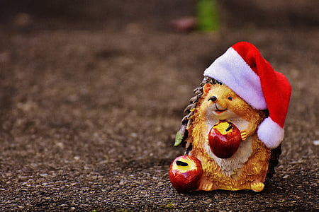 brown porcupine holding apple figurine thumbnail