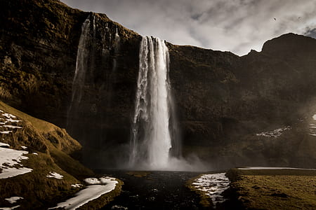 waterfalls during cloudy day thumbnail