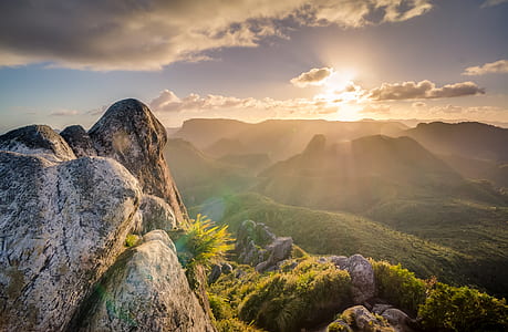 landscape photography of mountain with crepuscular rays thumbnail