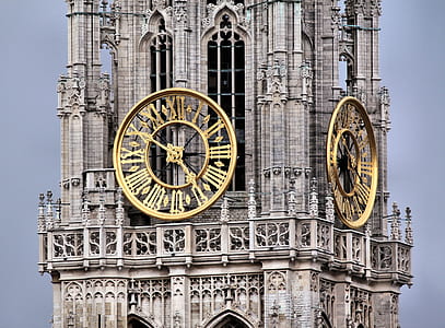 gray concrete building with analog clock thumbnail
