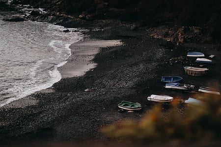 aerial photography of boats on seashore thumbnail