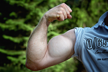 photo of person showing his left arm muscle thumbnail