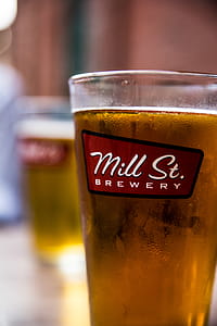 Mill St. Brewery Glass Filled With Yellow Liquid thumbnail