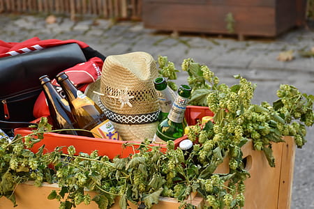 brown cowboy hat beside bottles on box thumbnail