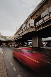time lapse photo of red car thumbnail