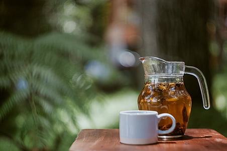 coffee cup beside glass pitcher thumbnail
