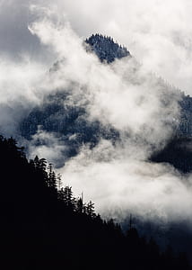 mountain with low-lying clouds during daytime thumbnail