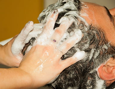 person shampooing man's hair thumbnail