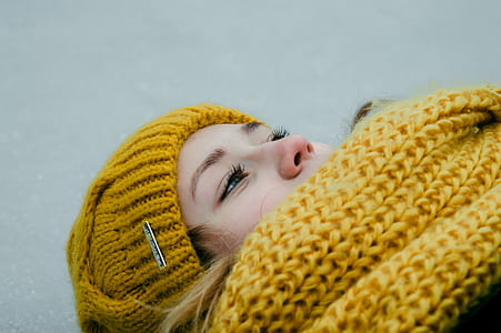 Woman Wearing Yellow Crochet Cap and Scarf thumbnail