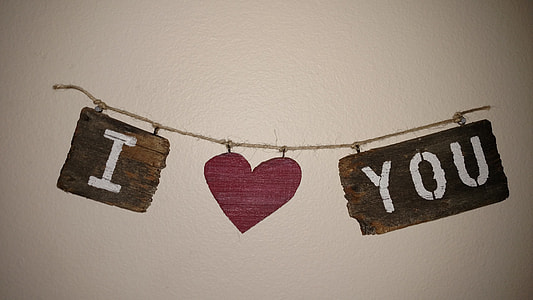 i love you hanging decor on white wall thumbnail