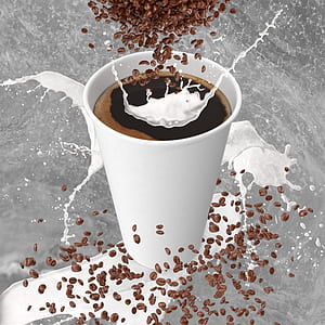 white disposable cup filled with black beverage thumbnail