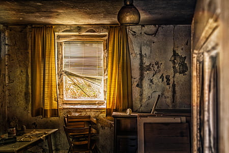 room with yellow curtains and chair near the window thumbnail