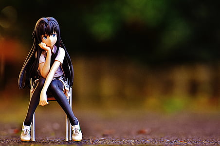 selective focus photography of female character sitting on chair thumbnail