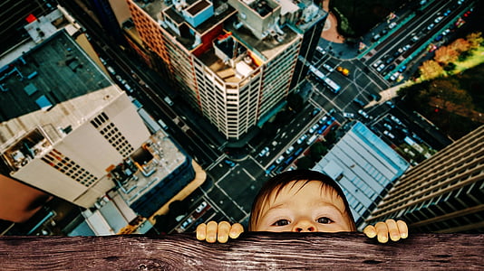 kid holding on brown wood digital photo thumbnail