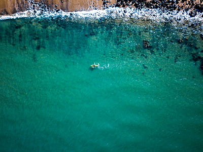 aerial photography of green sea water at daytime thumbnail