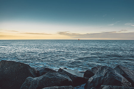 blue body of water during daytime thumbnail