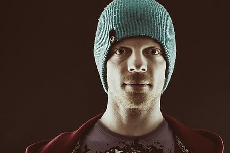 close-up photo of man wearing green knit cap thumbnail