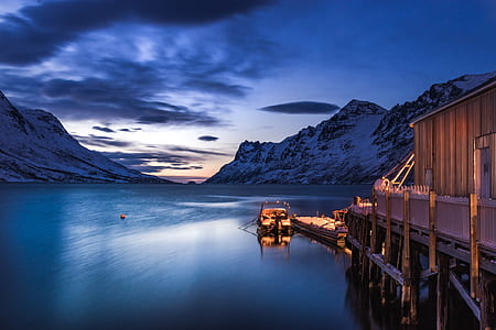 landscape photography of mountain near body of water thumbnail