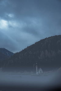 white cathedral near trees thumbnail