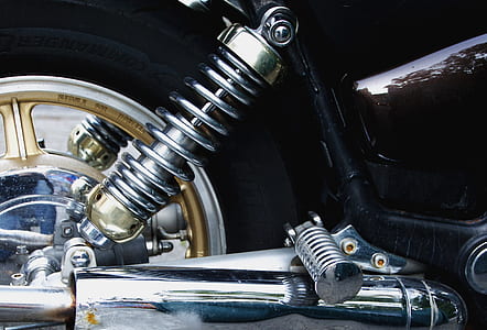 closed up photo of silver motorcycle coilover thumbnail