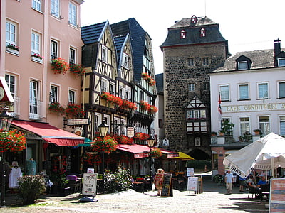 people walking beside buildings at daytime thumbnail
