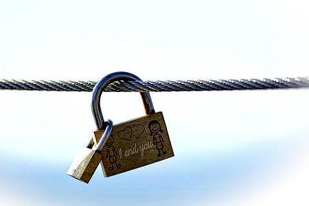 two brass-colored padlocks thumbnail