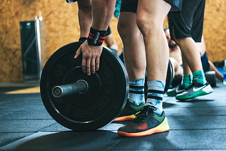 Person Holding Black Weight Plates thumbnail