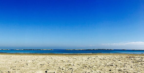 photo of empty beach during daytime thumbnail