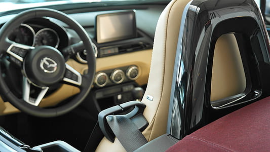 black and brown Mazda vehicle interior thumbnail