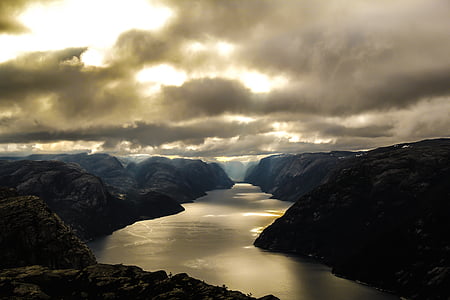 mountains near body of water during golden hour thumbnail