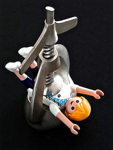 Lego minifigure in press machine thumbnail
