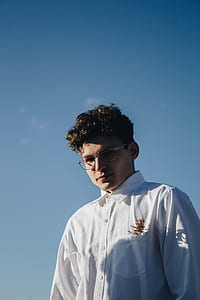man wearing white top thumbnail