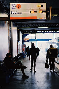 man waling on train station thumbnail