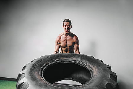 Man Lifts Tire Exercise Photo thumbnail