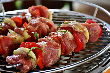 selective focus photography of skewered meat on grill thumbnail