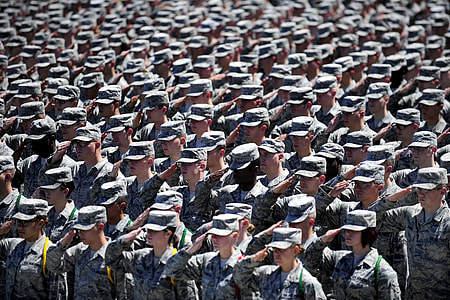 closeup photography of soldiers saluting during daytime thumbnail