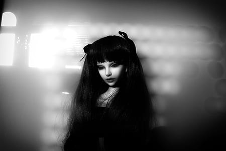 woman in black top on white wall thumbnail