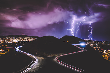 aerial photography of city with lightning bolt during nighttime thumbnail