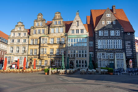several brown houses during daytime thumbnail