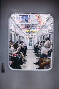 photo of people sitting inside of train thumbnail