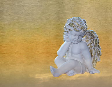 photo of cherub statue on beige background thumbnail