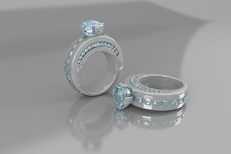 two silver-colored teal crystal encrusted rings thumbnail
