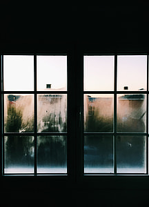 silhouette photography of closed white framed glass window thumbnail