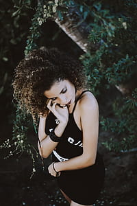 woman wearing black spaghetti-strap dress thumbnail