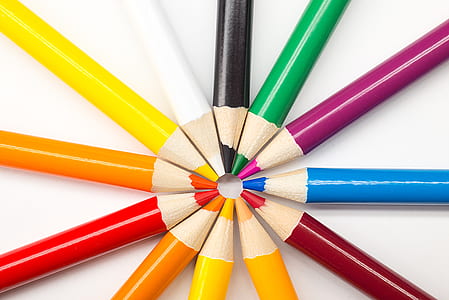 assorted-color pencils on white surface thumbnail