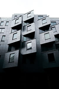 low-angle photography of gray concrete building thumbnail