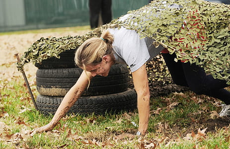 woman crawling through game course thumbnail