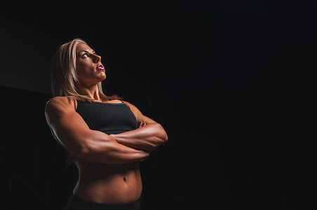 woman in black sports bra staring upward thumbnail