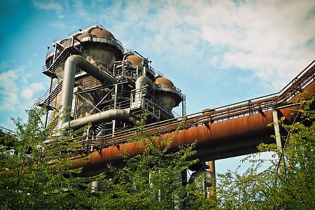 low-angle photography of industrial tower with pipe thumbnail